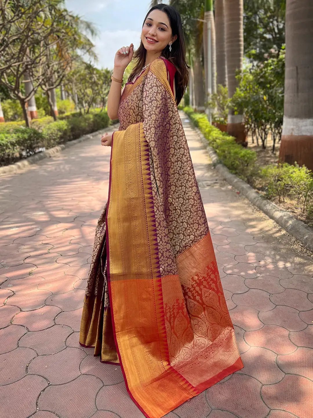 Side view of brown gold tissue saree with intricate jacquard design