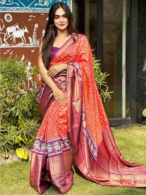 Elegant orange Bandhej silk saree with luxurious Pattu Zari border