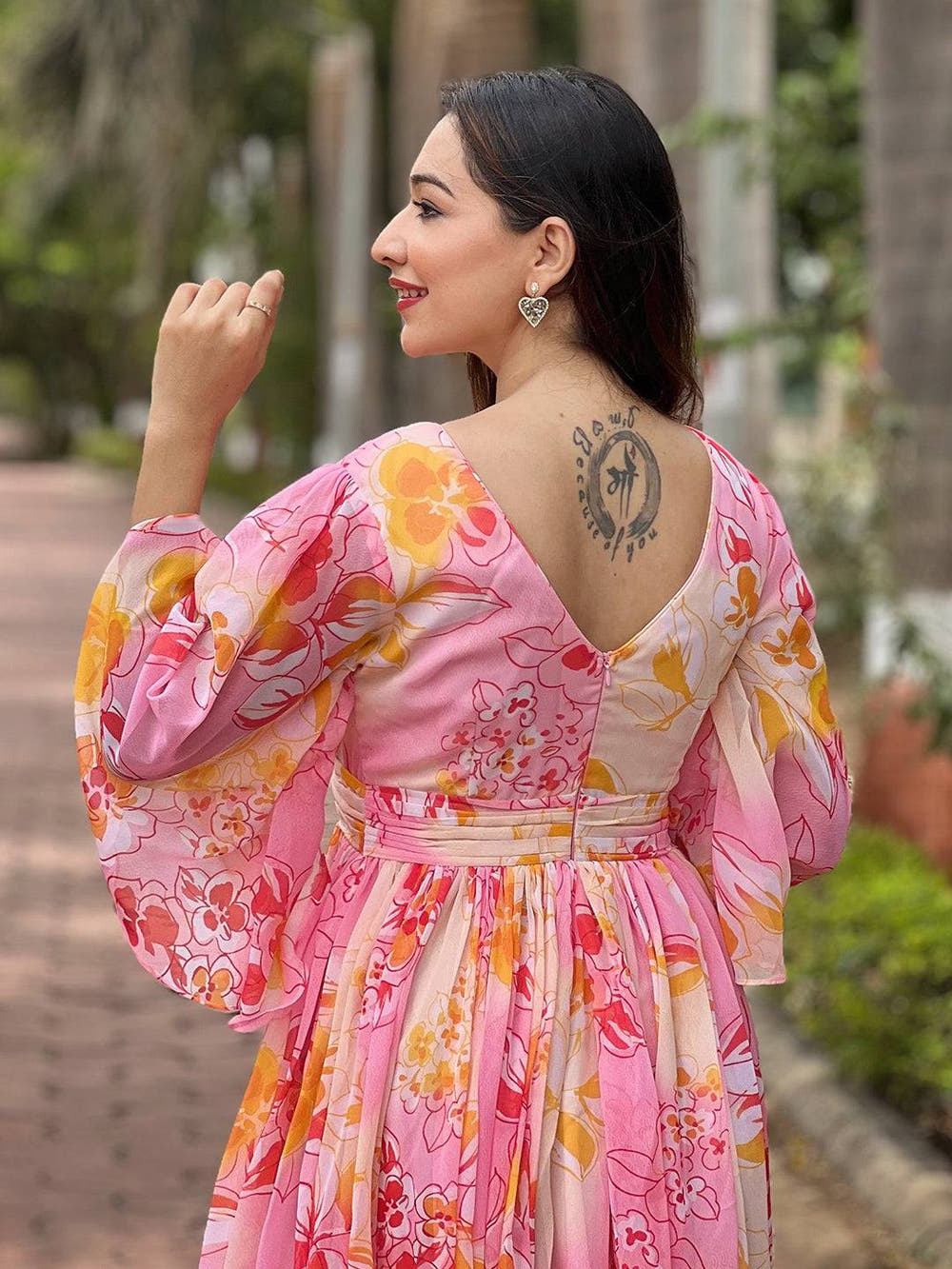 Back view of peach dress with floral abstract design