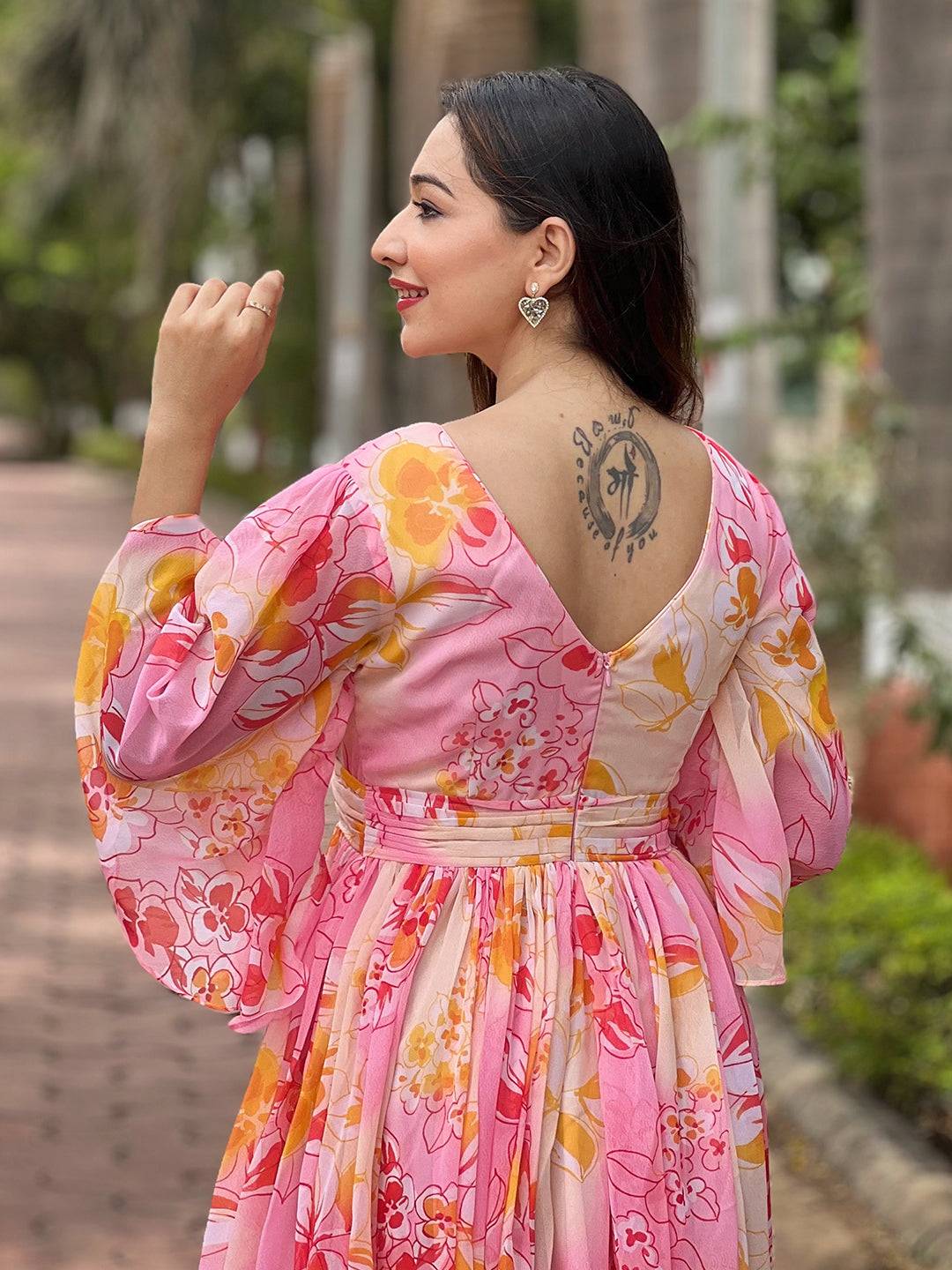 Back view of peach dress with floral abstract design