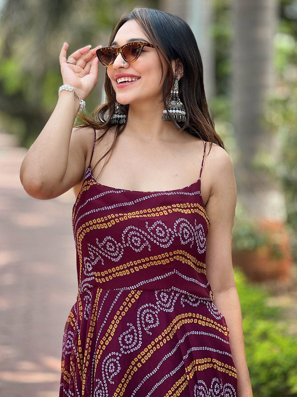 Close-up of Wine Bandhej Printed Dress with sunglasses