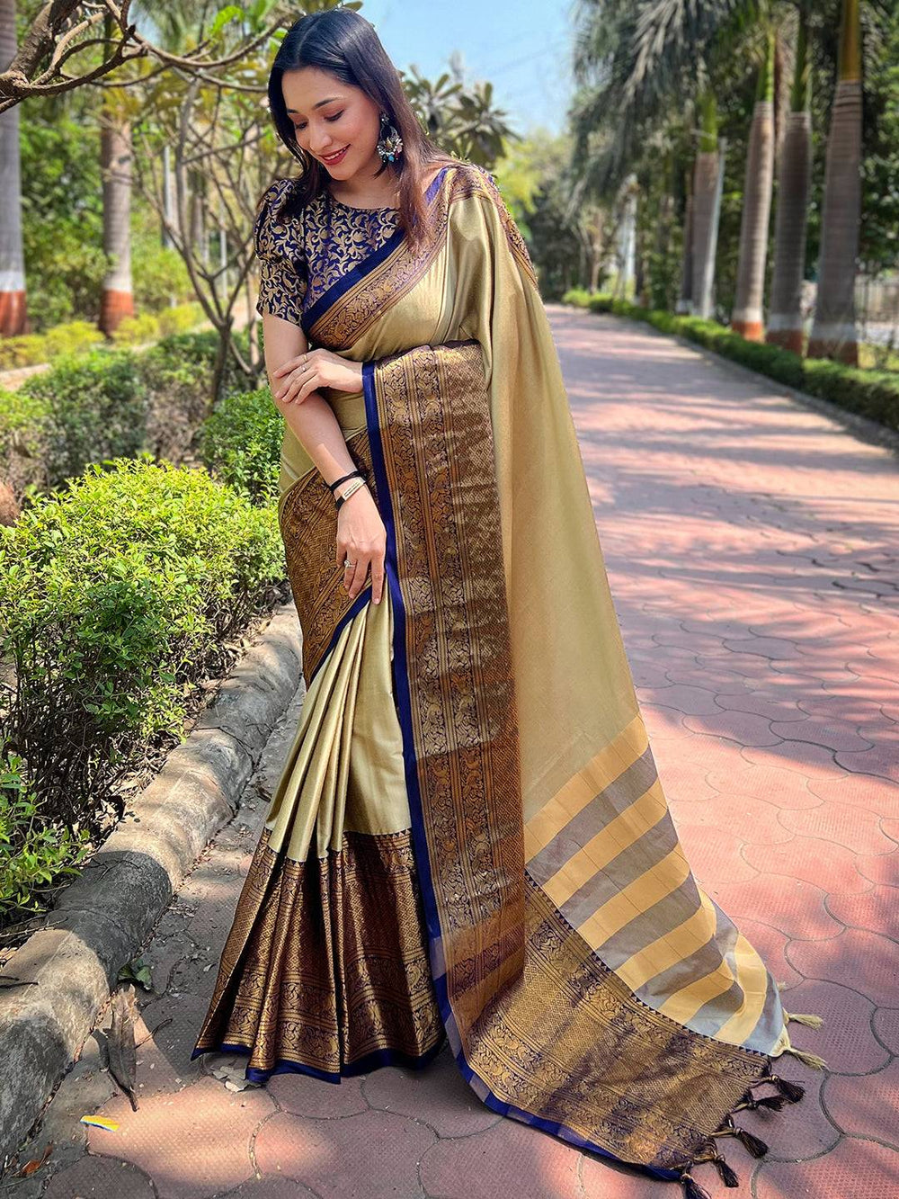 Elegant olive Kanjivaram saree with detailed border design