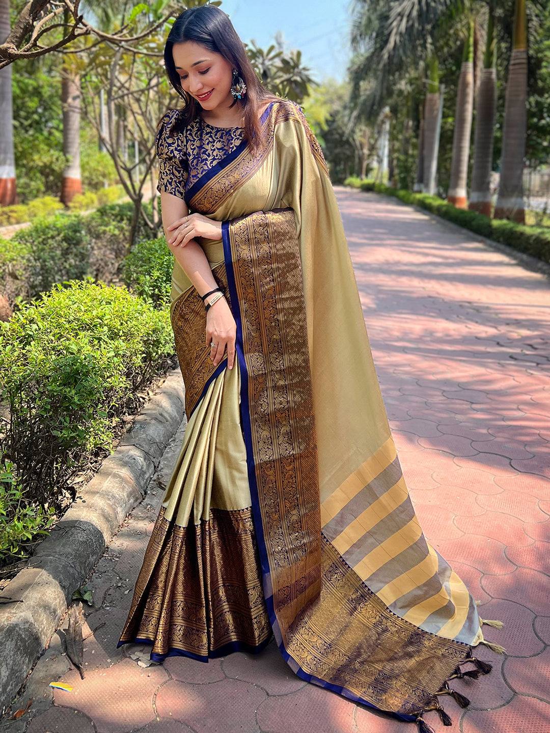 Elegant olive Kanjivaram saree with detailed border design