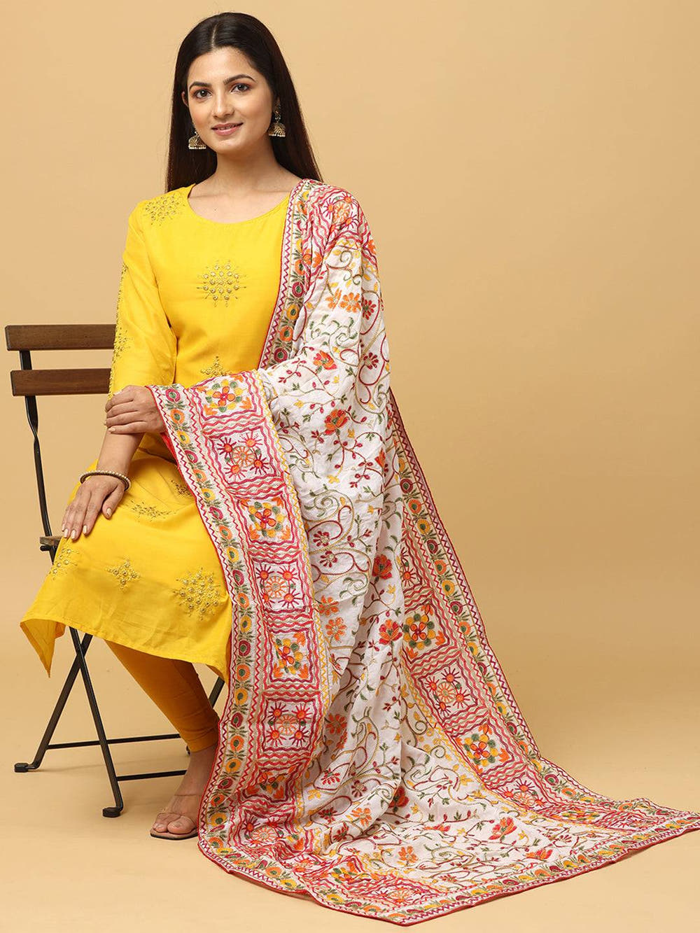 Seated model showcasing poly chiffon pashmina dupatta design