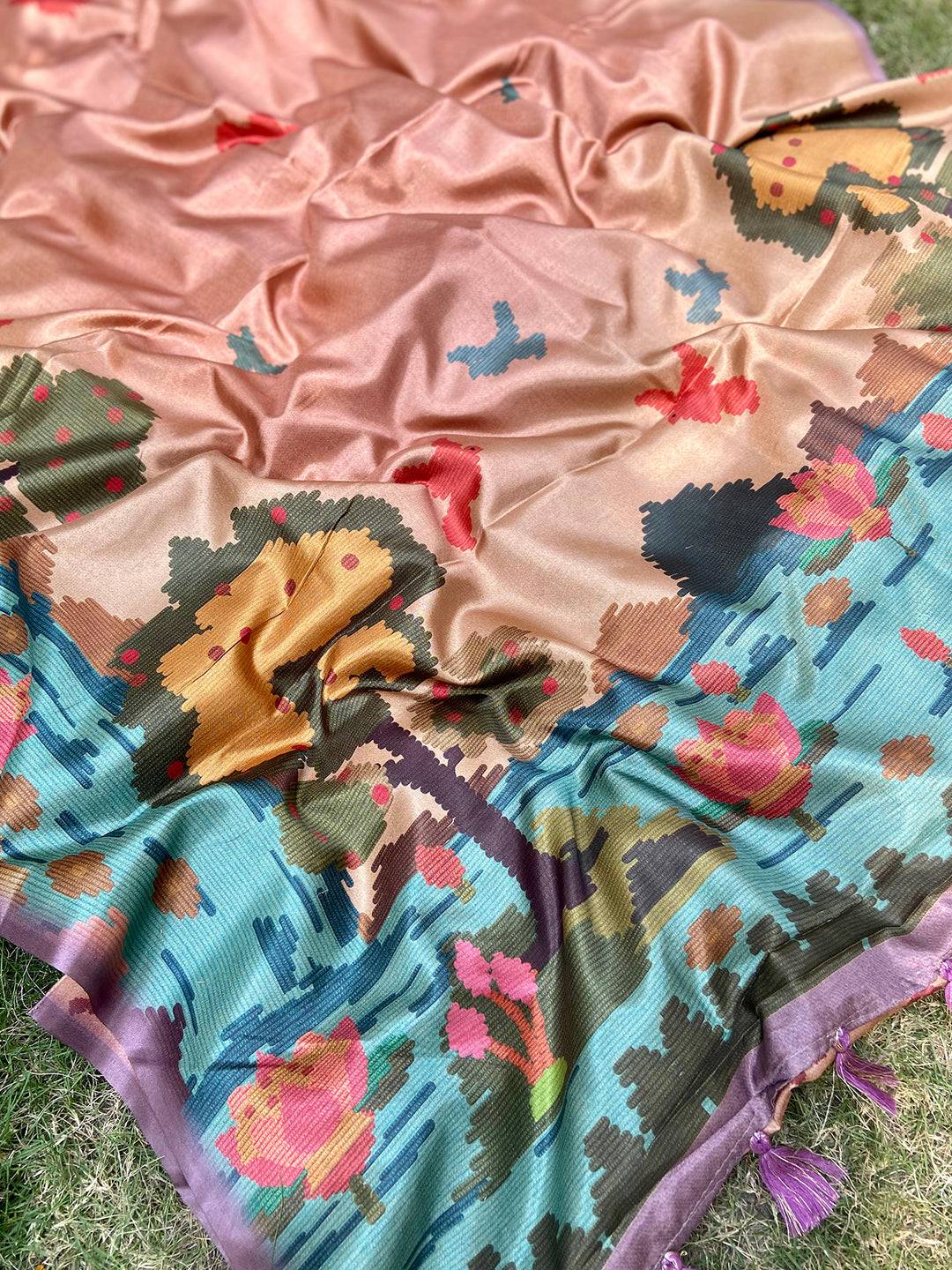 Brown Tussar silk saree with vibrant Kalamkari Ikkat design.