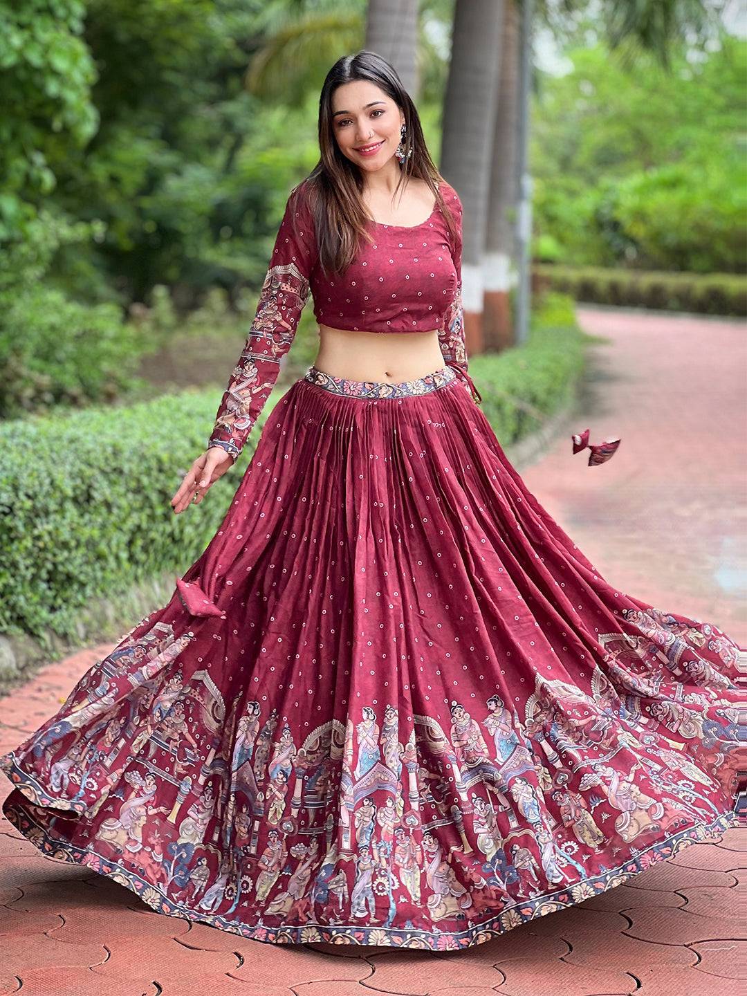 Deep maroon Kalamkari lehenga set twirling outdoors