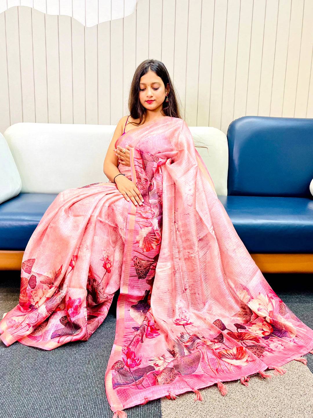 Woman wearing pink Kota Doriya silk saree with floral print