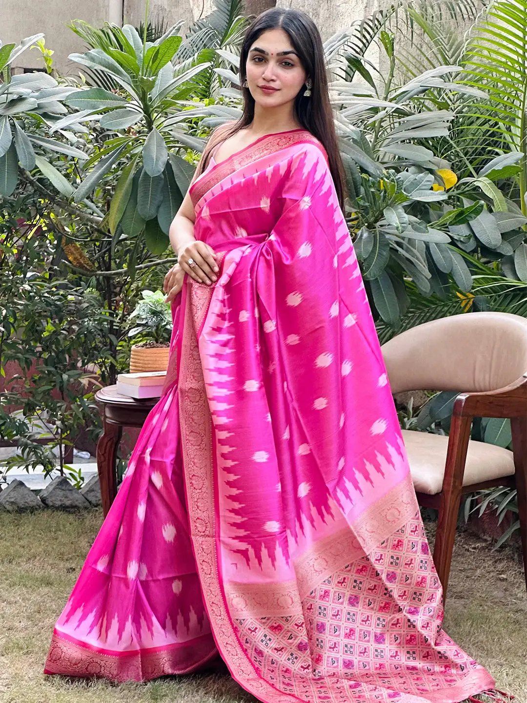 Model in pink Banarasi saree with intricate zari patola design