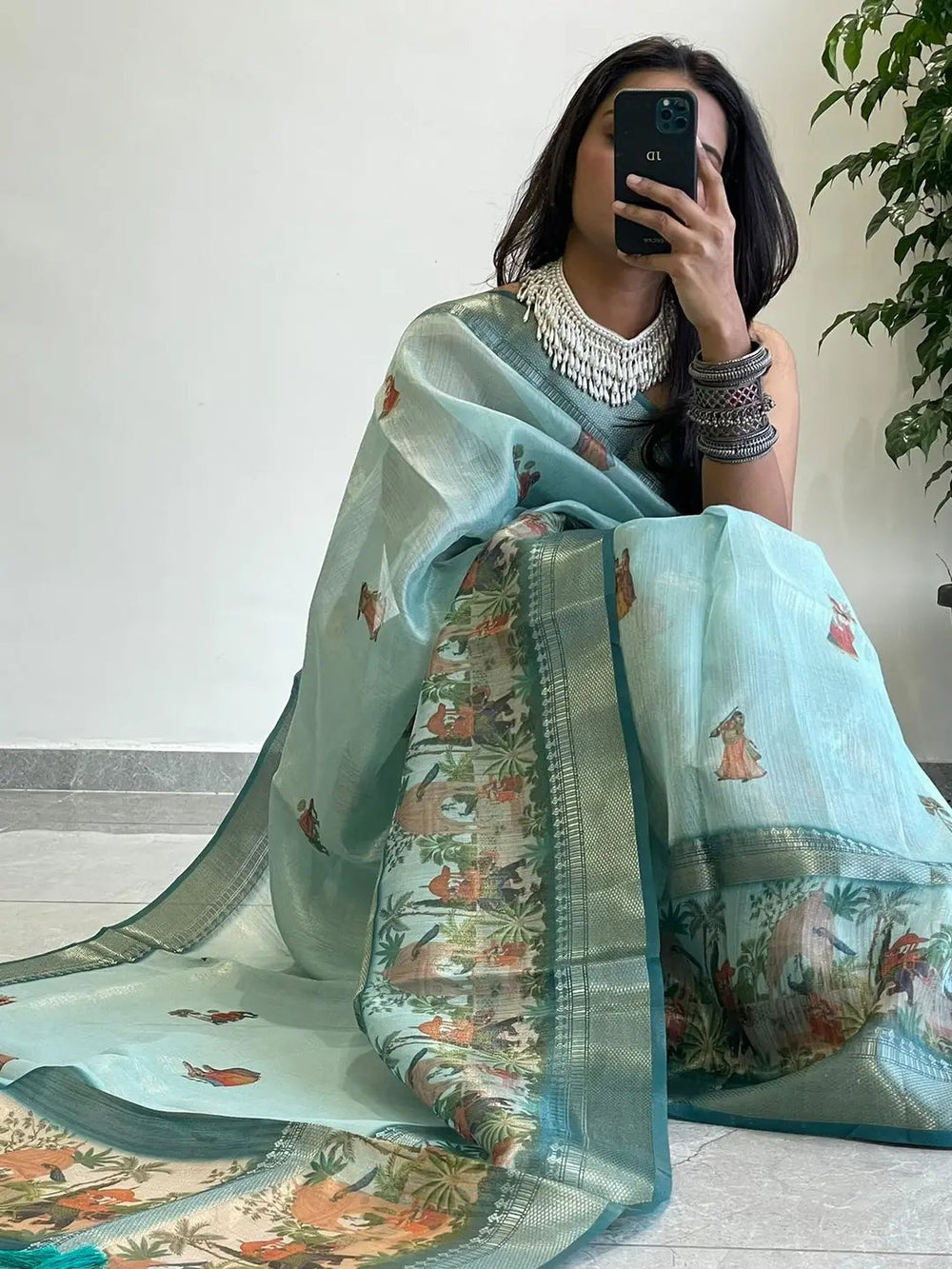 Elegant tissue saree showcasing intricate digital prints