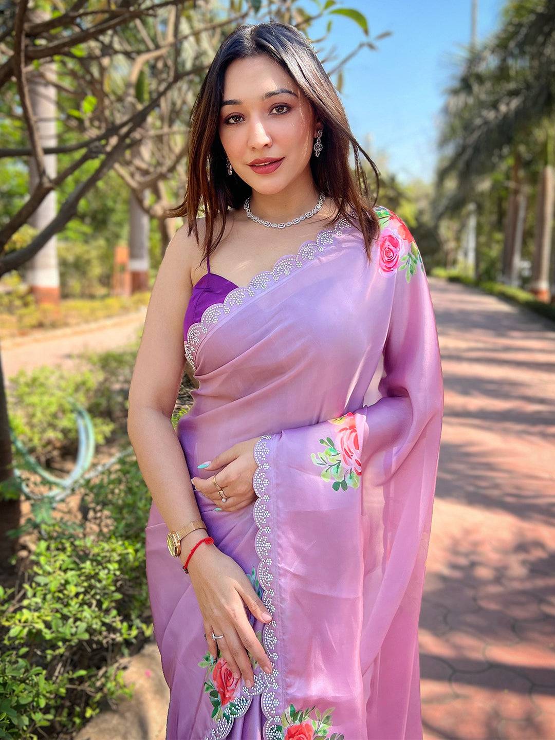 Lavender satin georgette saree with floral print and Swarovski border