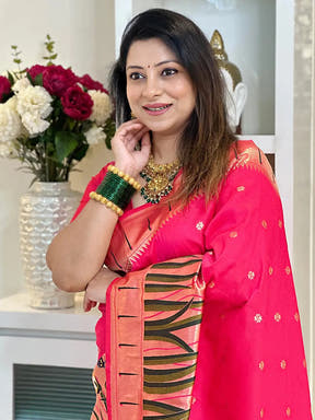 Close-up of pink Paithani silk saree, detailed border