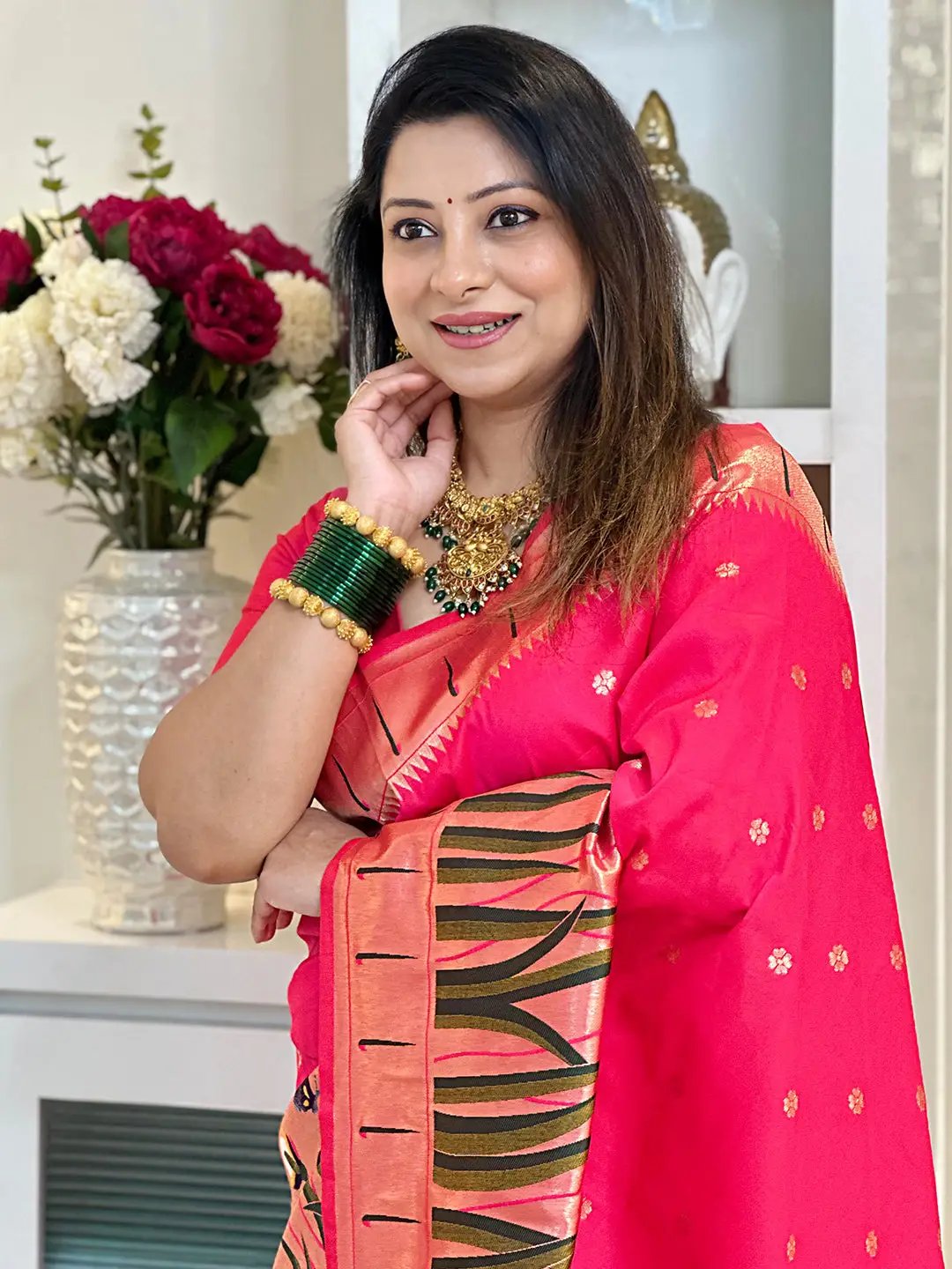 Close-up of pink Paithani silk saree, detailed border