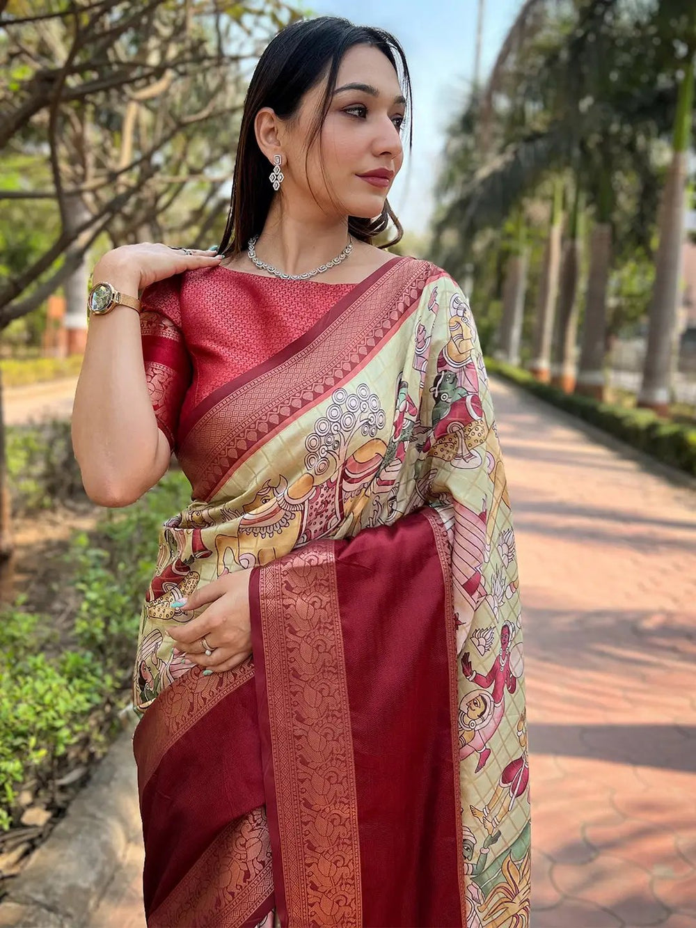 Close-up of red Banarasi silk saree with detailed patterns
