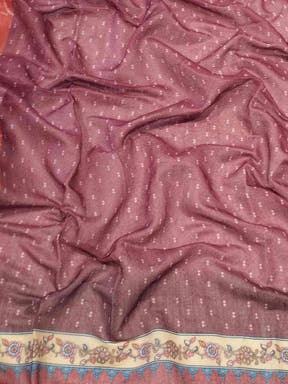 Close-up of red linen saree fabric with Bandhej pattern