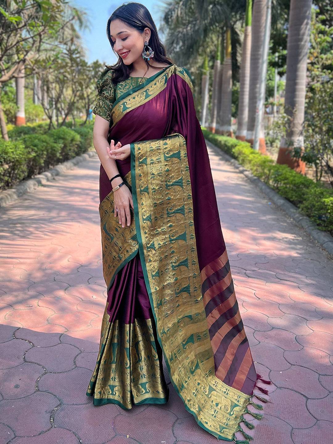 Elegant wine Kanjivaram saree with intricate gold designs