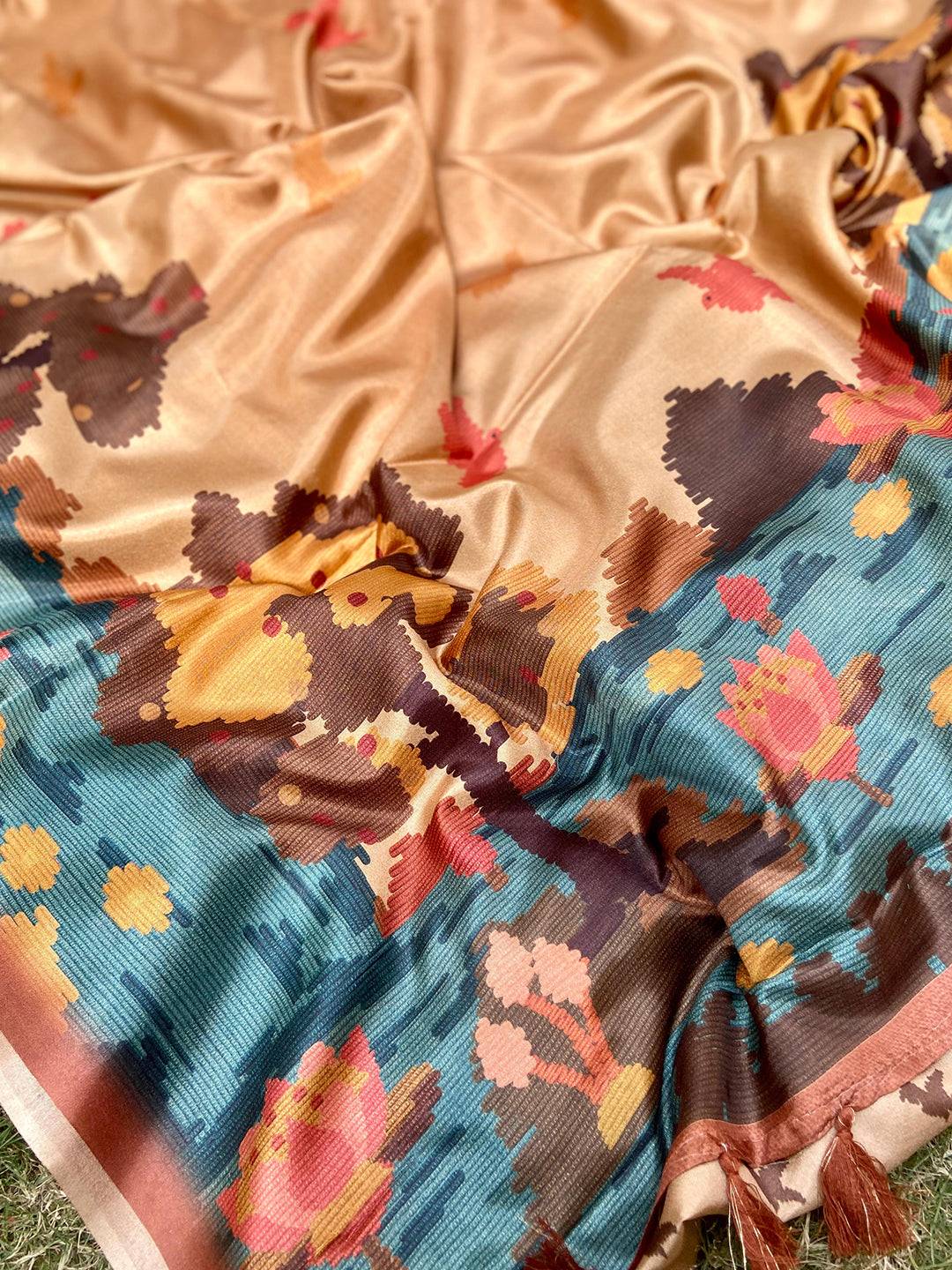 Kalamkari print saree with vibrant floral and bird motifs.