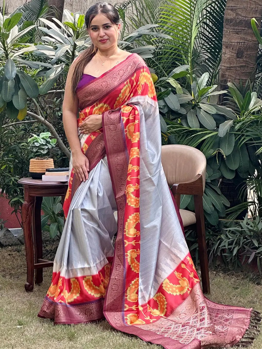 Stylish Banarasi soft silk saree featuring zari patola pallu outdoors