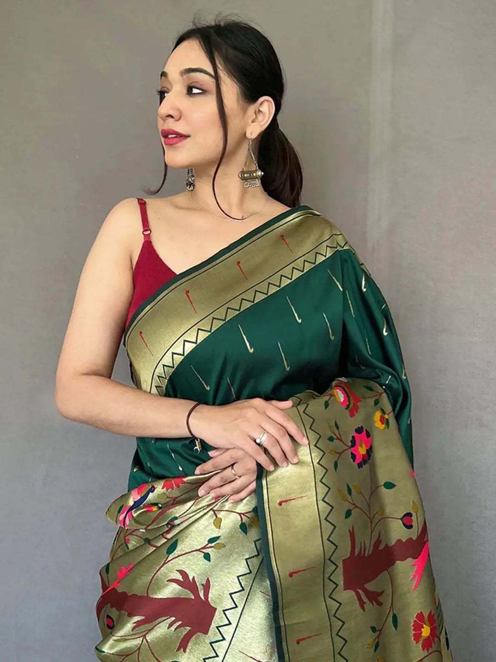 Close-up of Bottle Green Paithani saree with detailed zari work