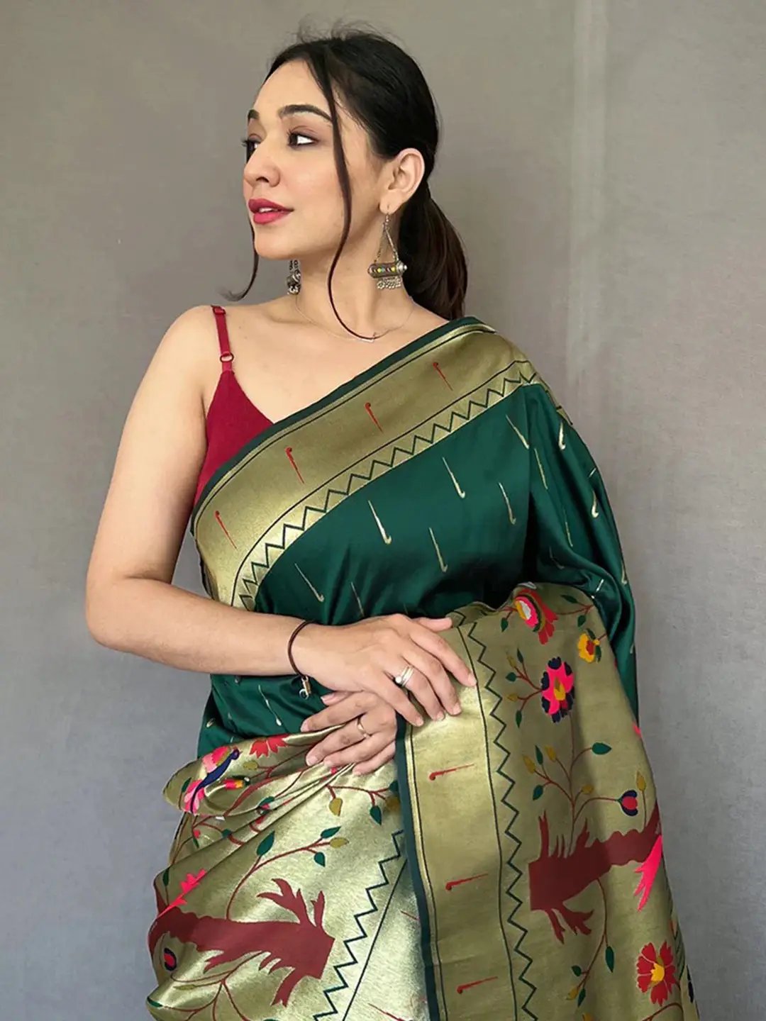 Close-up of Bottle Green Paithani saree with detailed zari work