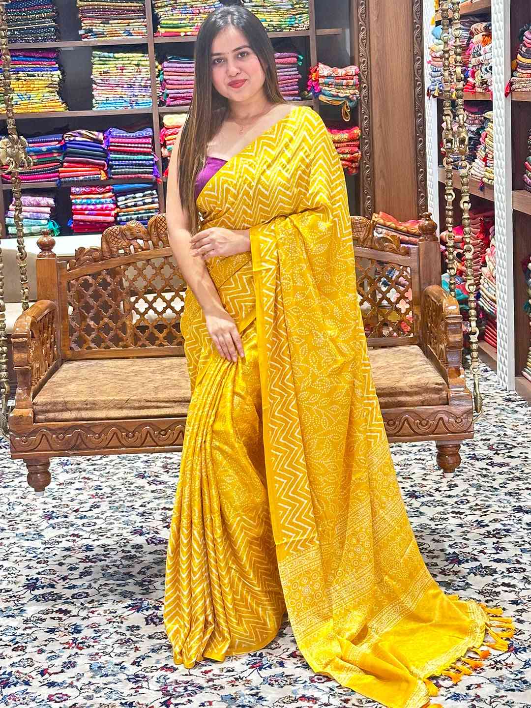 Elegant yellow Manipuri silk saree with intricate foil print design.