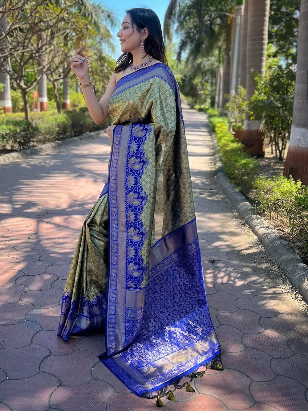 Elegant olive tissue Kanjivaram saree in outdoor setting