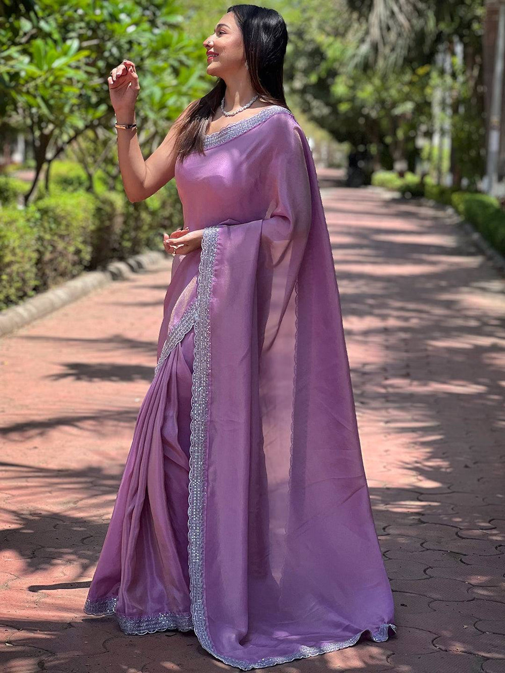 Side view of Salvia Lavender Viscose Saree in garden
