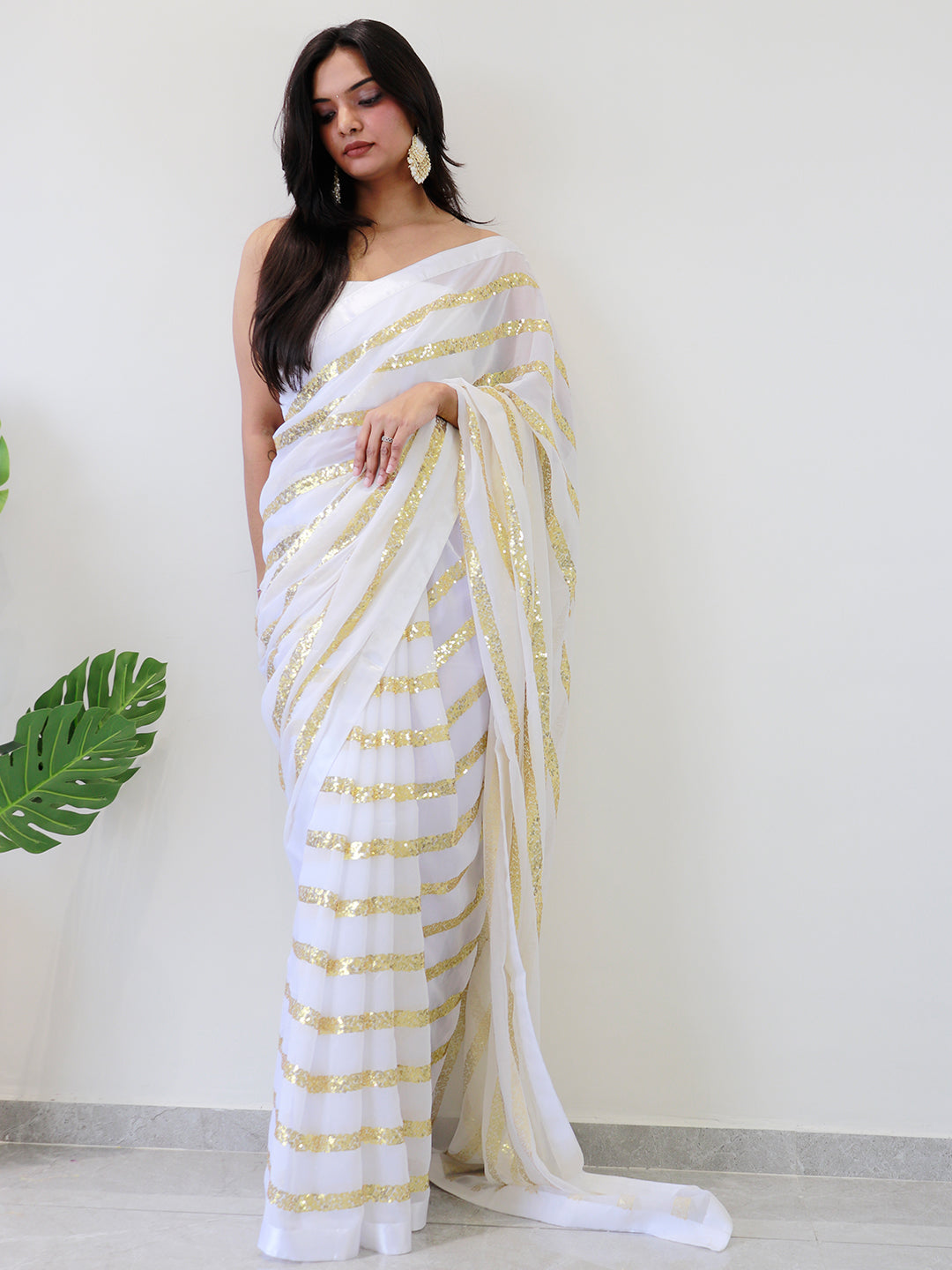 Modern elegance georgette saree with gold striped sequins