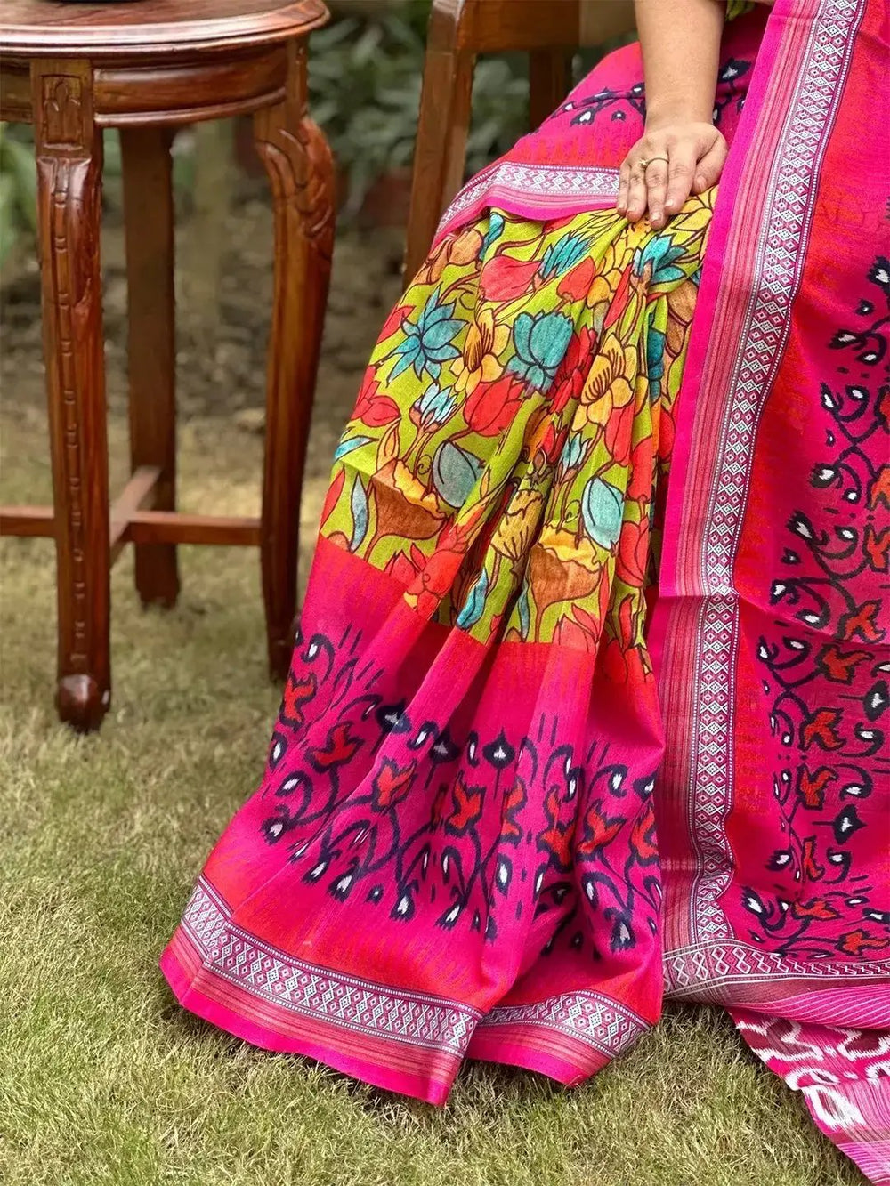 Detailed view of floral Ikkat saree fabric and border