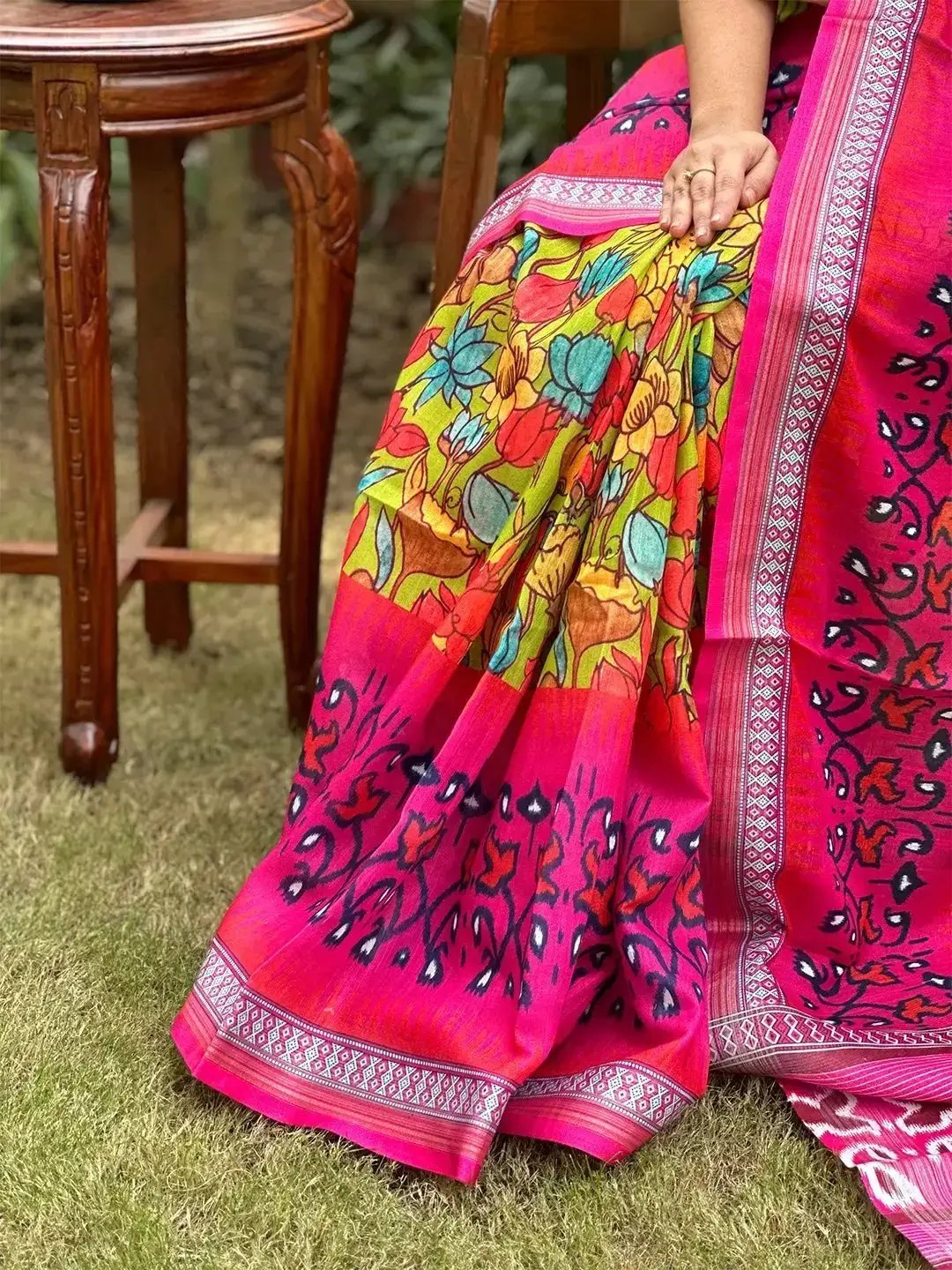 Detailed view of floral Ikkat saree fabric and border