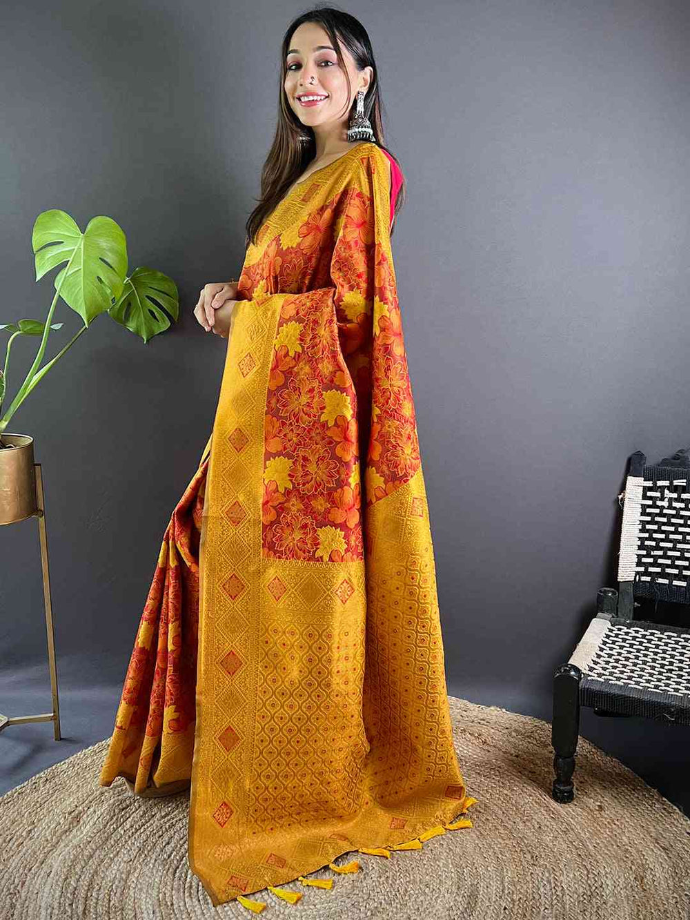 Rust silk saree with detailed butta weaving, side view