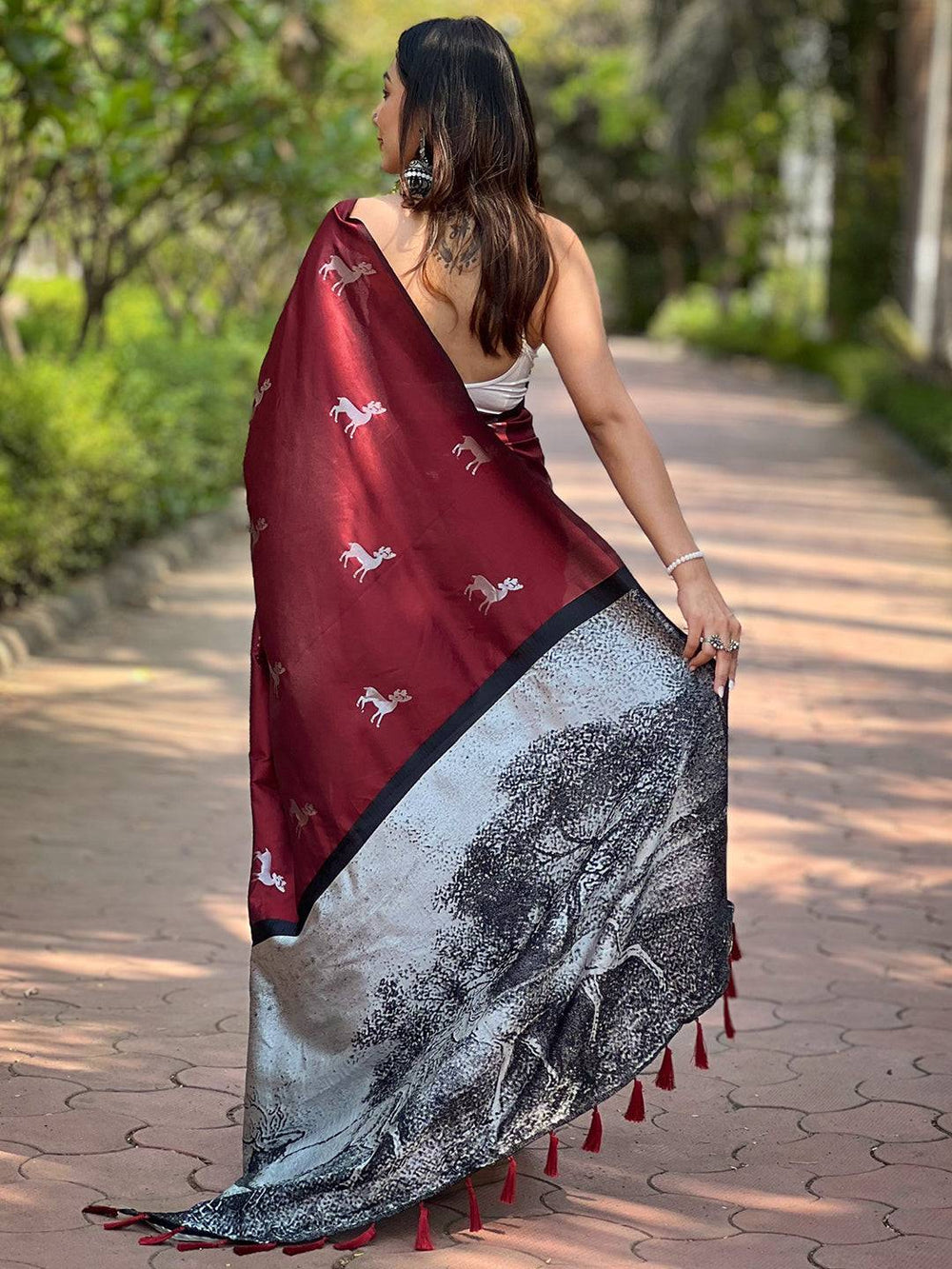 Back view of maroon soft silk saree showcasing zari pallu