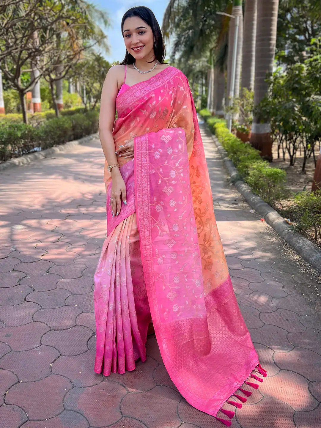 Model in pink slub silk saree with zari and Lakhnavi weaving