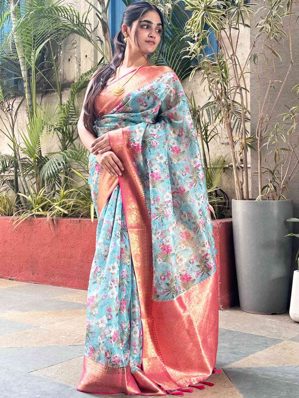 Stylish turquoise Kota silk saree with floral design