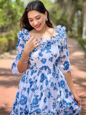 Close-up of White Jasmin dress with frill details