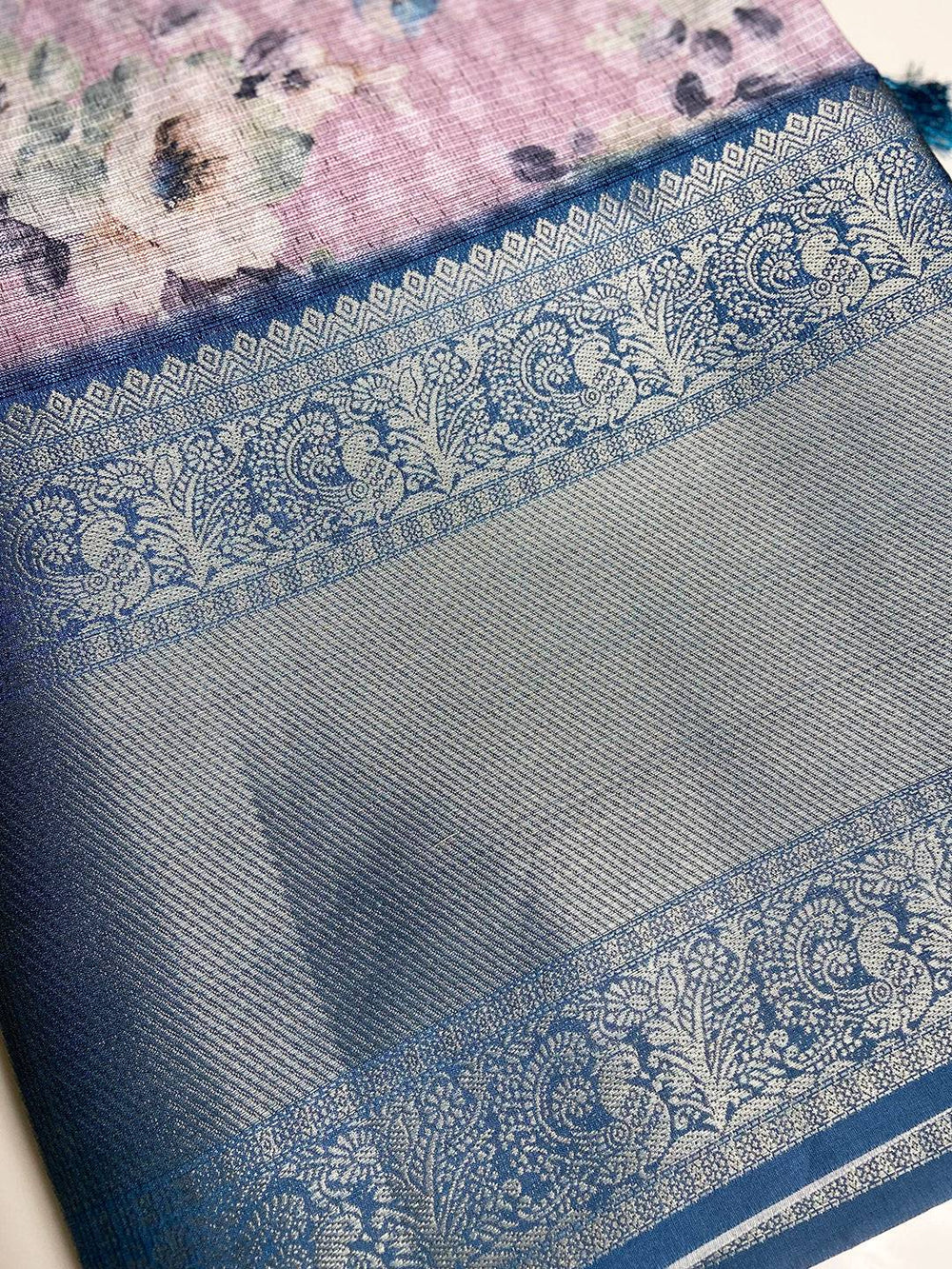 Blue zari border on floral print saree fabric