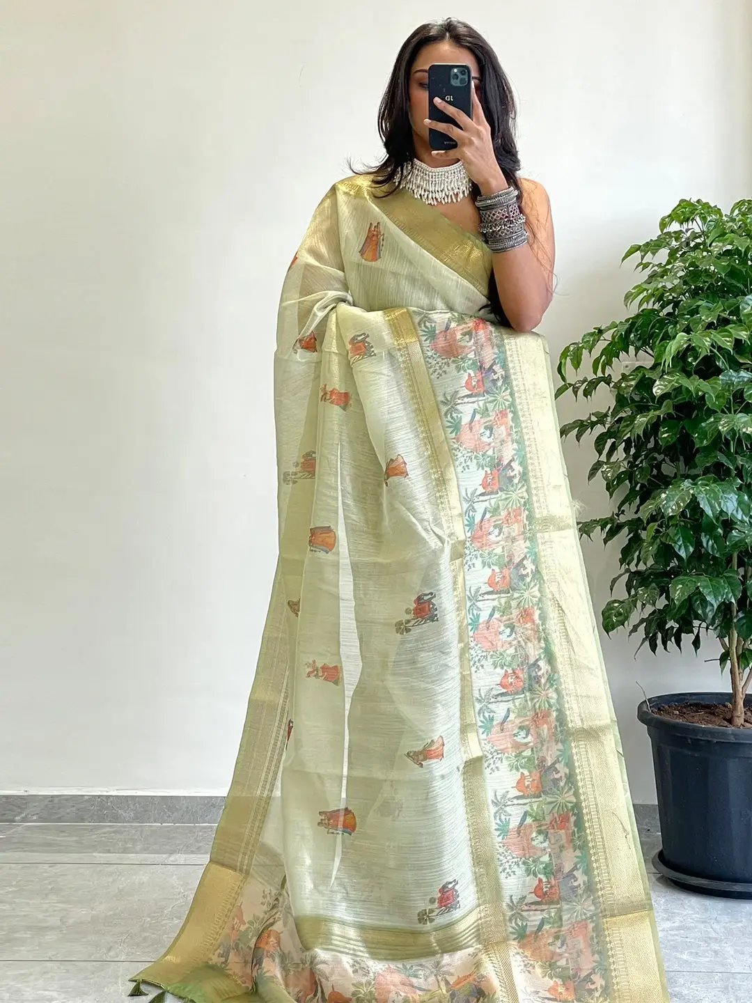 Elegant Soft Gold Zari Tissue Saree with intricate patterns
