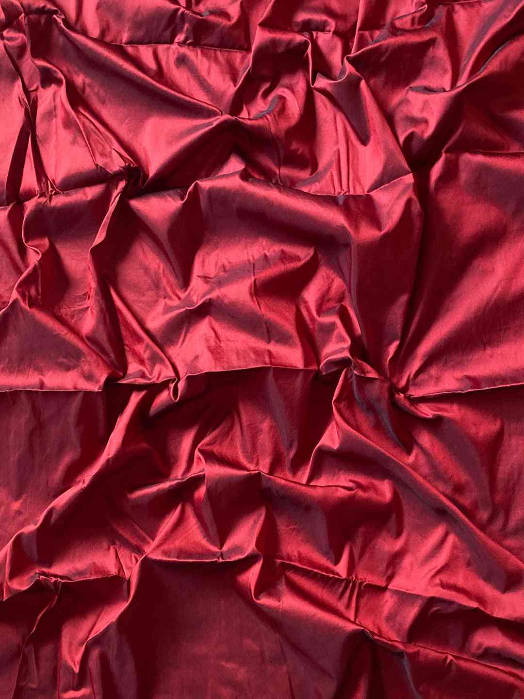 Rich red fabric, smooth and luxurious texture