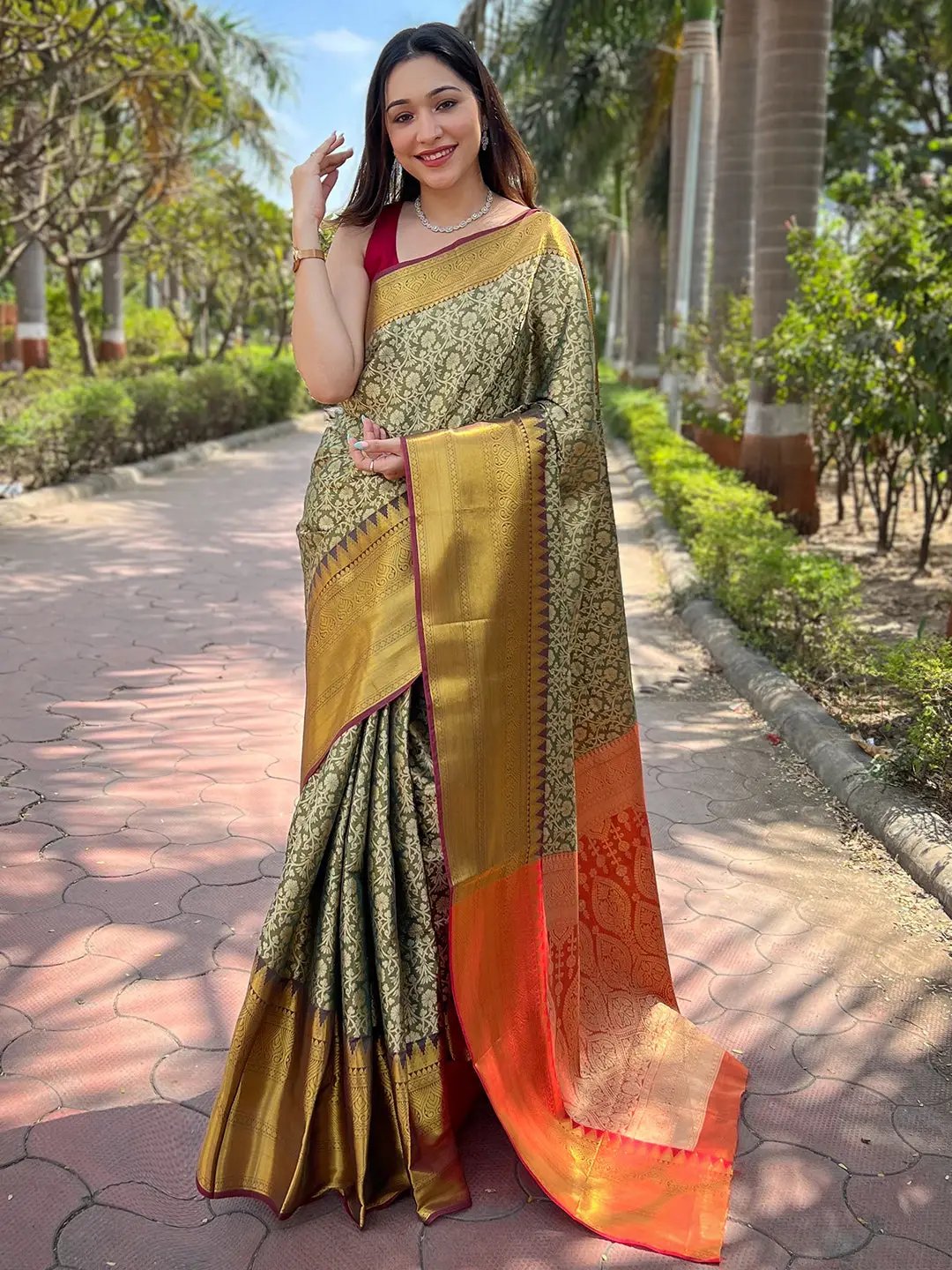 Green gold tissue saree with jacquard work, outdoor setting