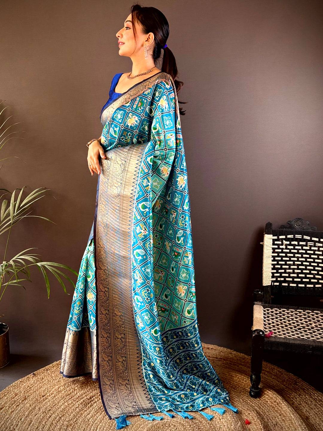 Side pose showcasing Ombre Sky Blue Soft Silk Patola Print Saree.