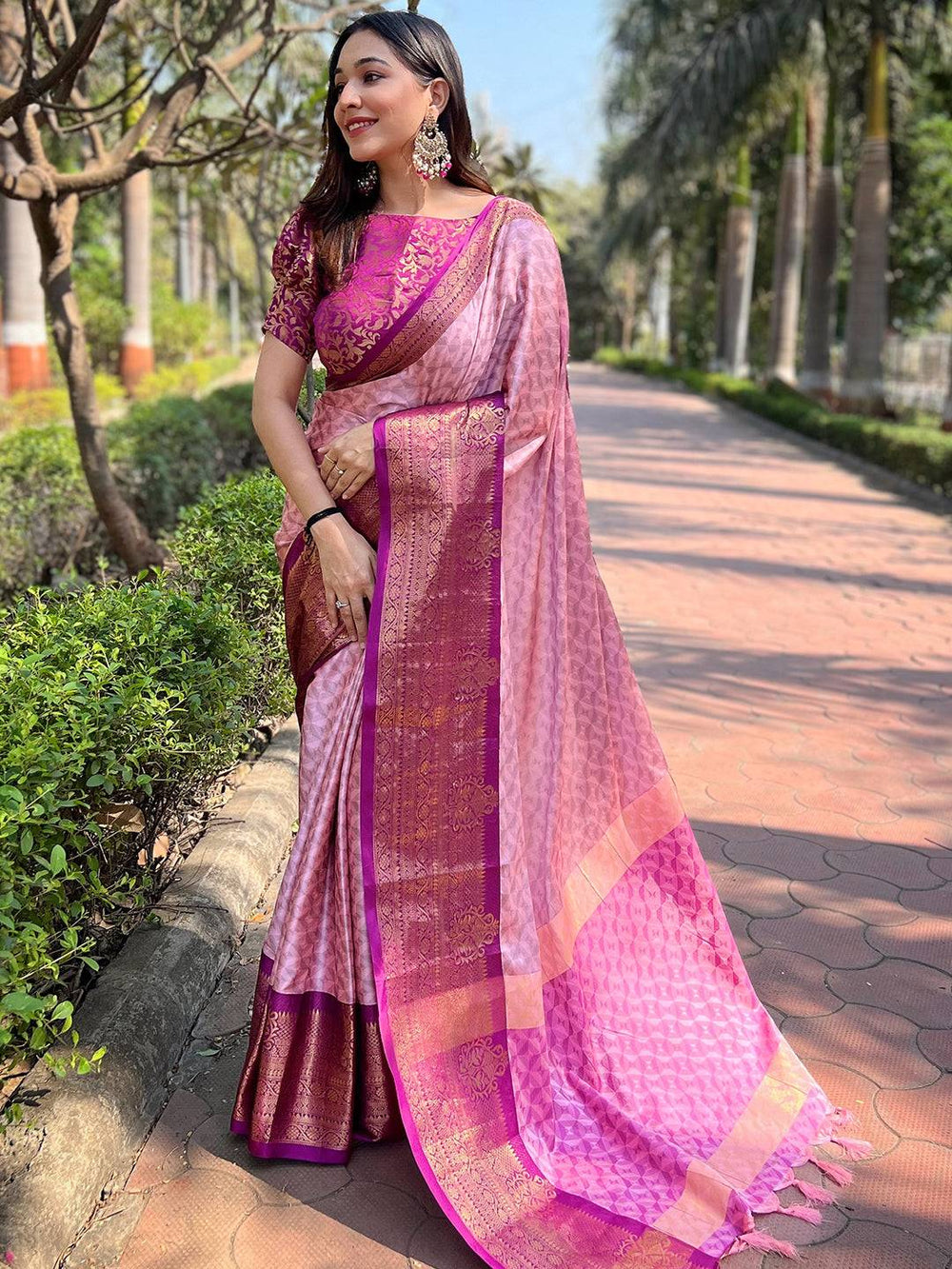 Beautiful pink Kanjivaram saree with rich zari patterns