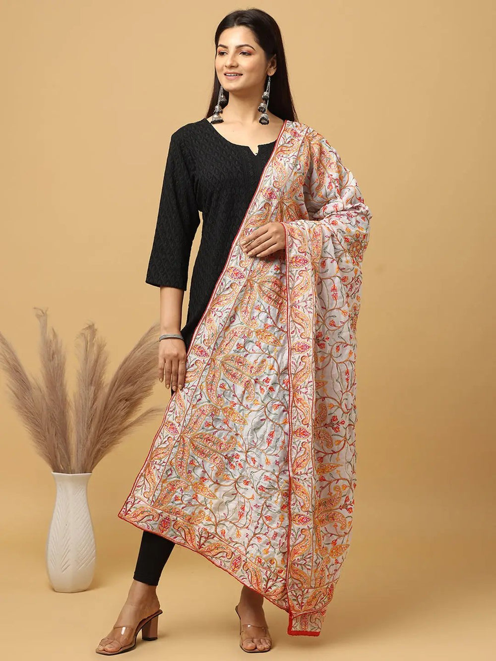 Model showcasing Bollywood white chiffon dupatta with ethnic motifs.