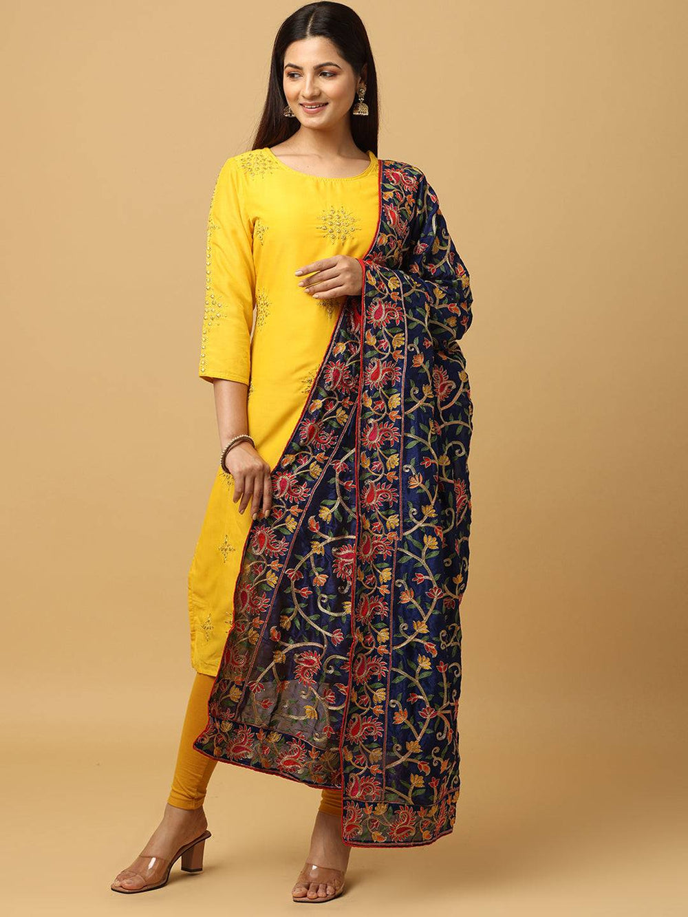 Model wearing navy poly chiffon pashmina dupatta, side view.