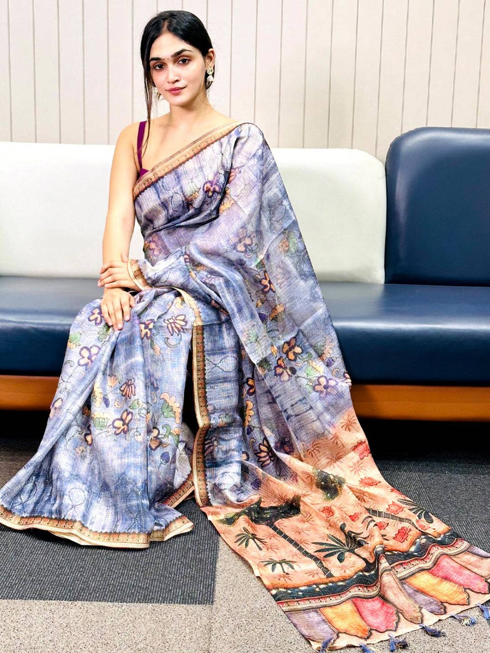 Blue Kota Doriya silk saree with floral print draped elegantly.