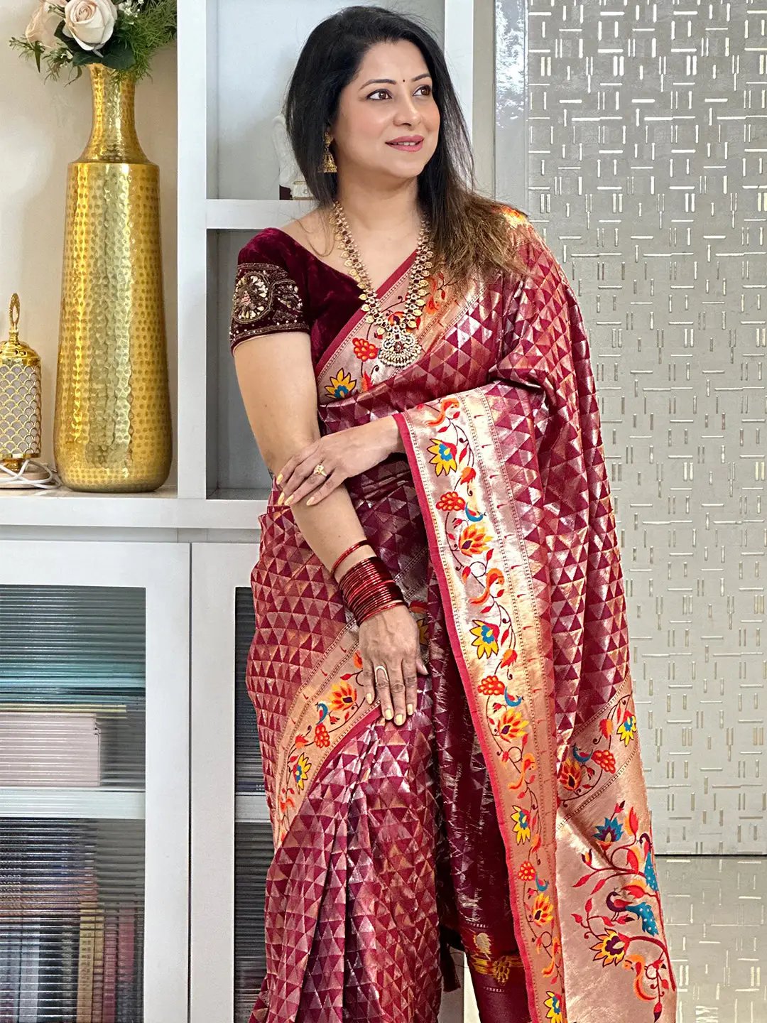 Wine silk blend Paithani saree with zari work, worn by a model.
