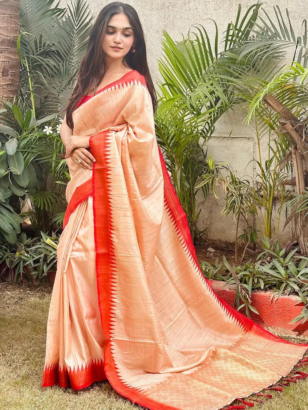 Traditional Peach Silk Saree with Intricate Zari Border
