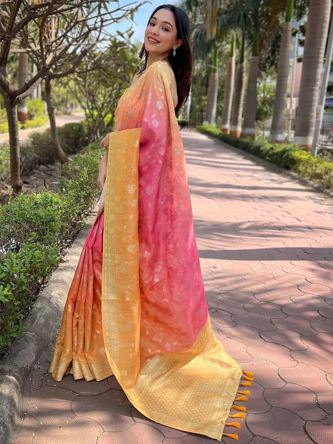Back view of pink Bollywood soft slub silk saree with zari details