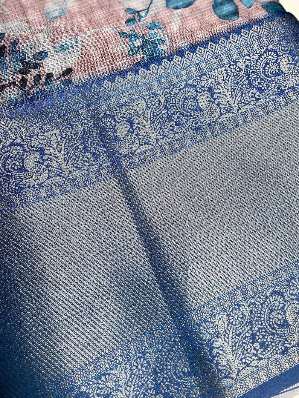 Detailed view of zari border on Muvel Kota Doriya saree with floral print
