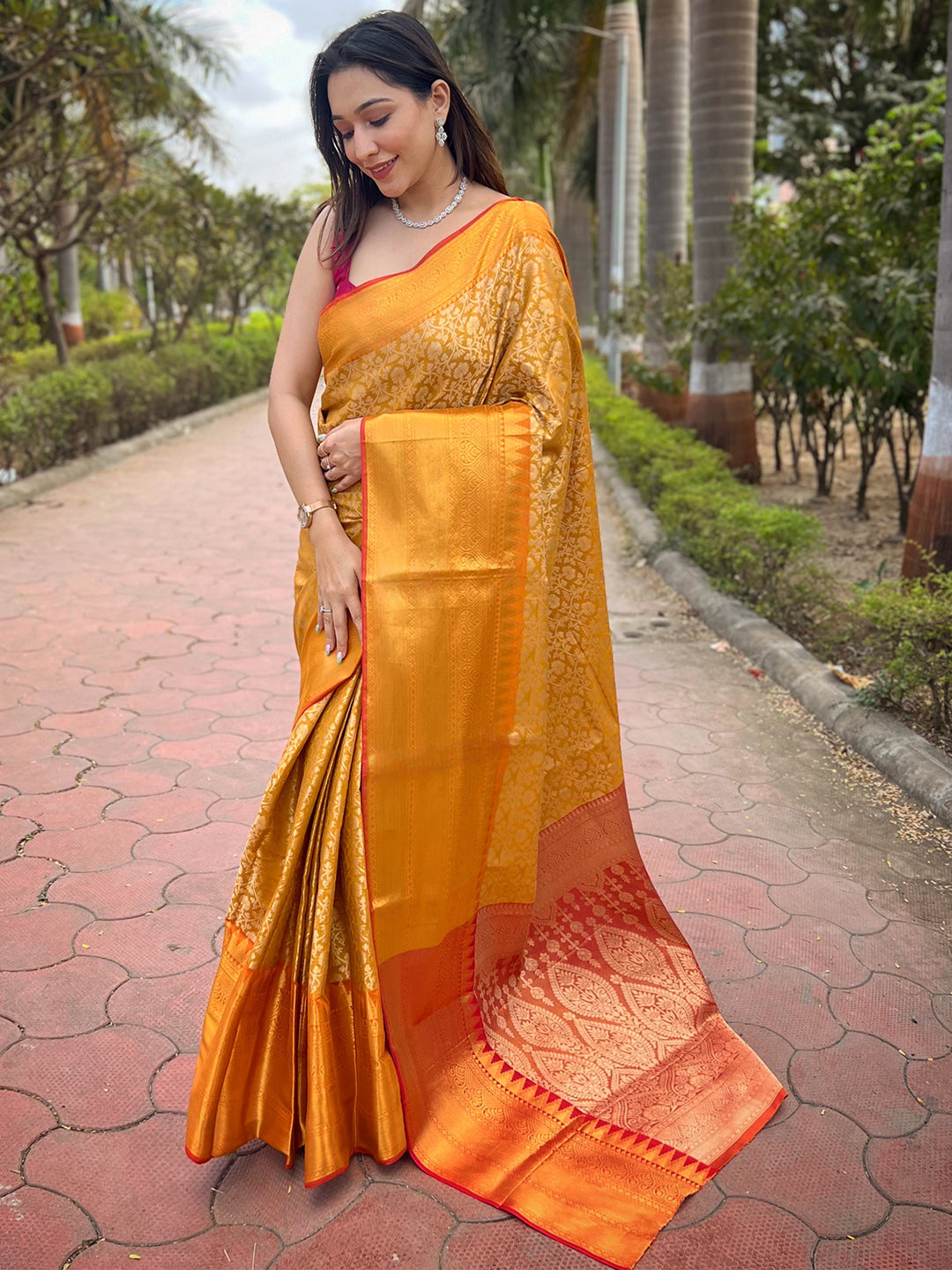 Elegant yellow gold tissue saree with intricate jacquard design