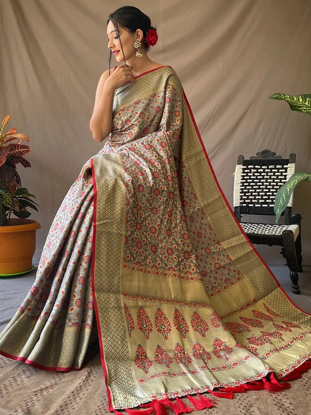 Stylish grey Patola silk saree with intricate zari patterns