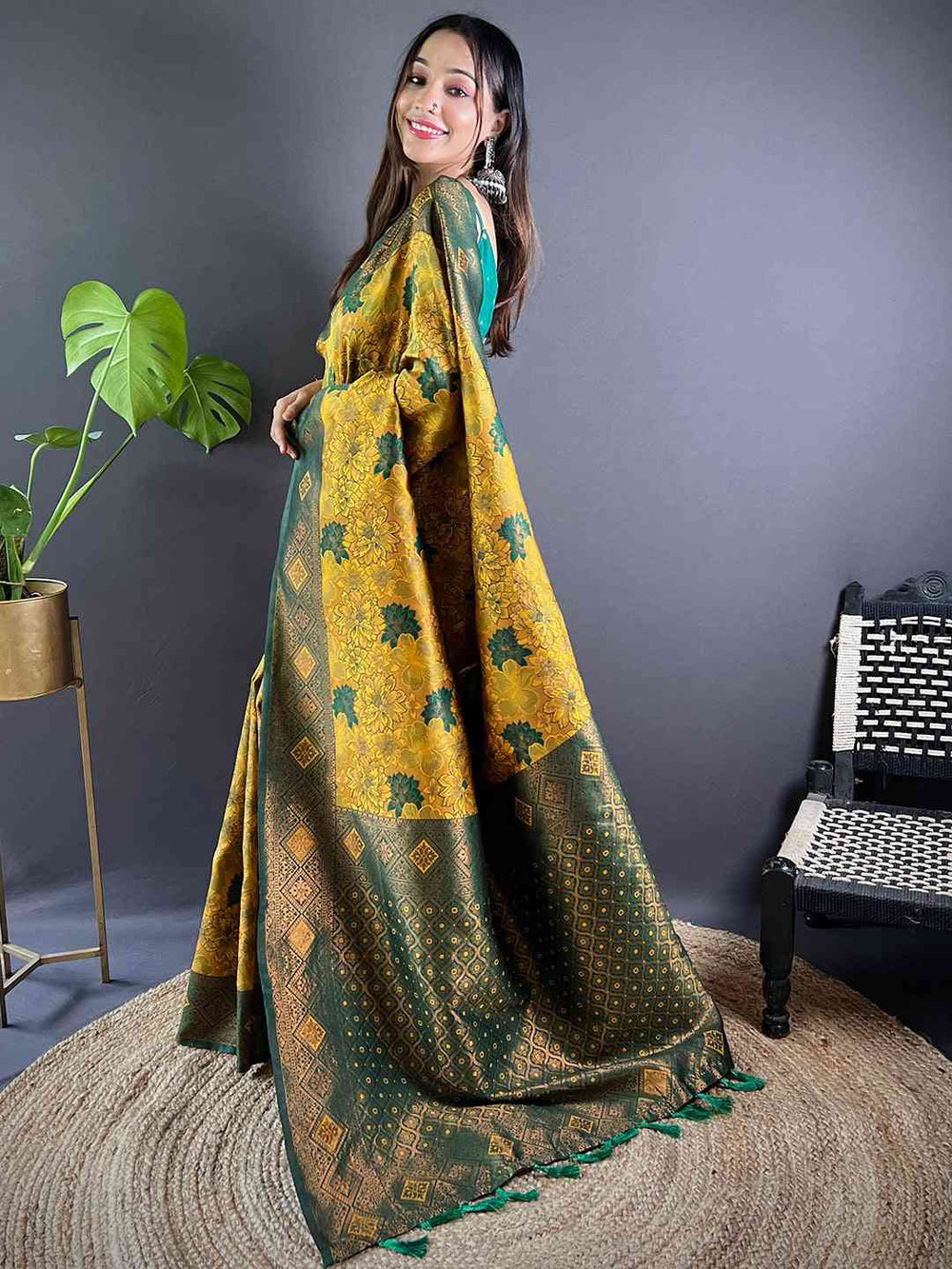Side view of mustard silk saree with elegant butta weaving.
